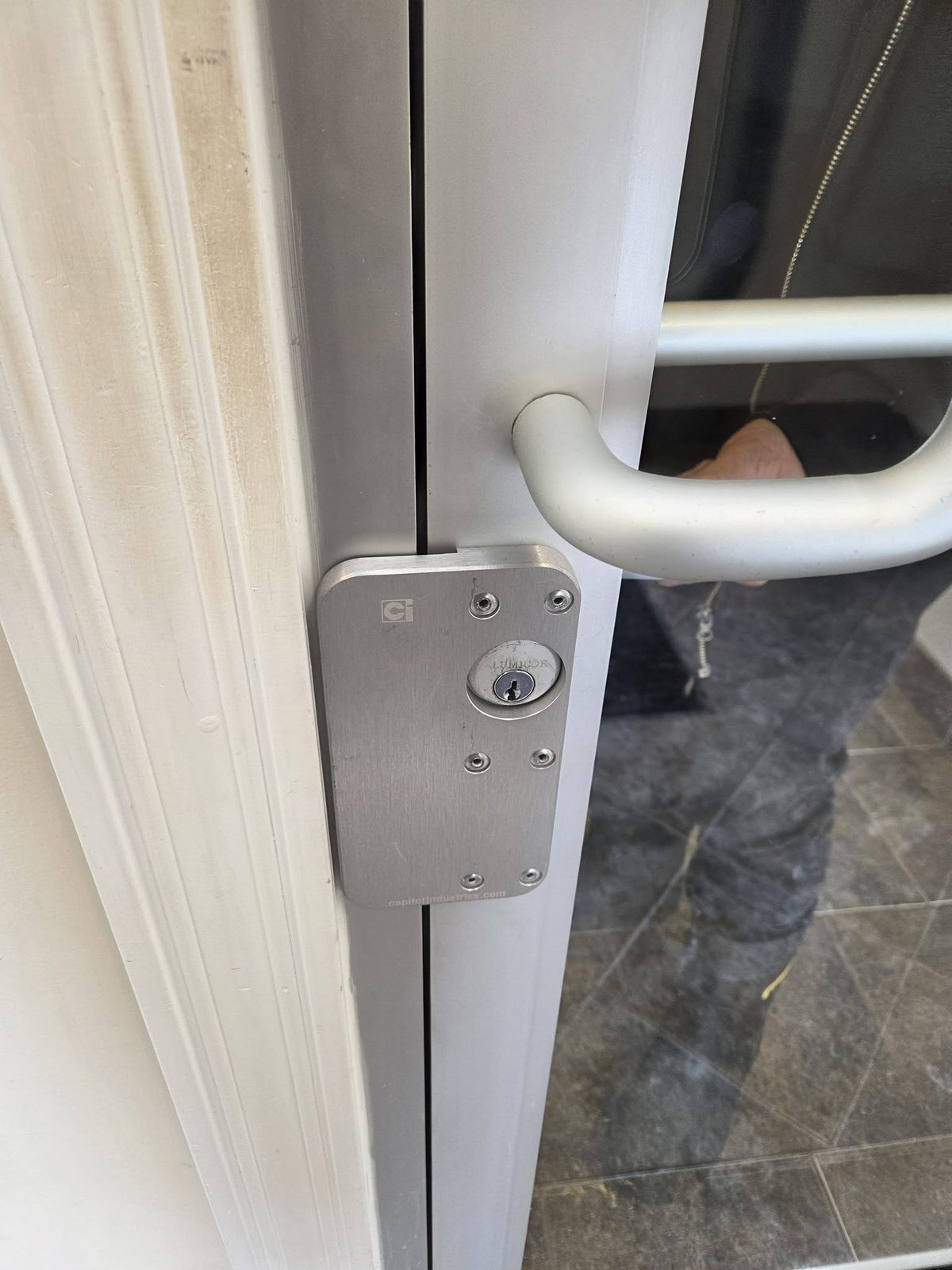Commercial lock installed on a glass storefront door